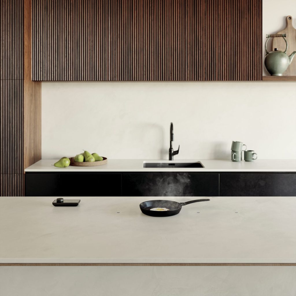 Cuisine design sur mesure avec plaque à induction invisible NOVY Undercover intégrée au plan de travail